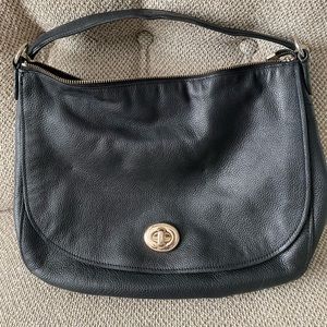 Midsized Black shoulder Coach purse